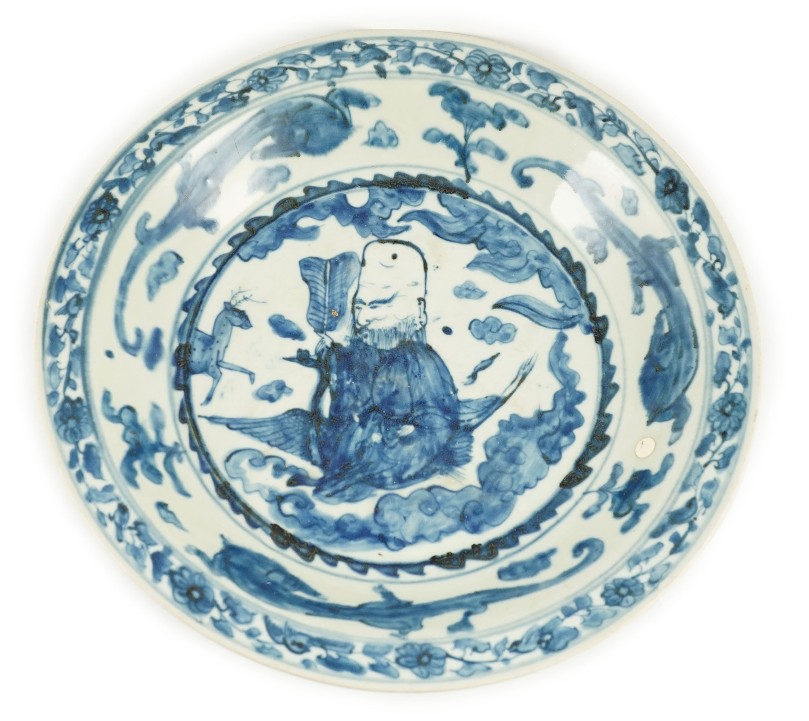 A large Chinese Swatow blue and white ‘Shou Lao’ dish, Zhangzhou kilns, Wanli period, 43.4cm diameter, tiny rim chip